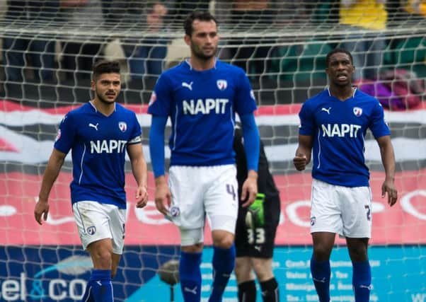 Dejected Chesterfield players see their play off final dreams in tatters. Photo: James Williamson