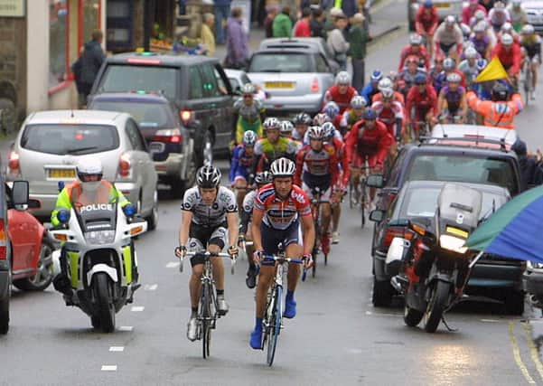 Hathersage, Tour of Britain, the main peleton pass through Hathersage