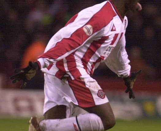 Steve Kabba celebrates after scoring