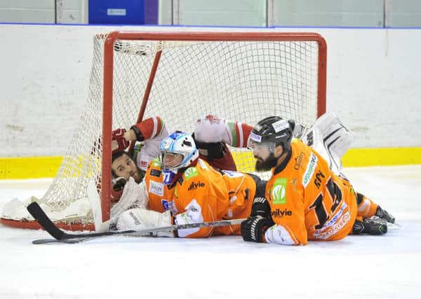 Marek Pinc and Mathieu Roy - in the thick of it. Picture by Dean Woolley