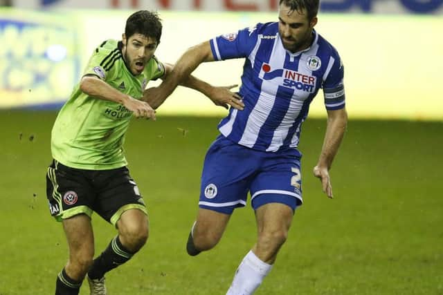 Ryan Flynn of Sheffield Utd takes on Reece James of Wigan Athletic