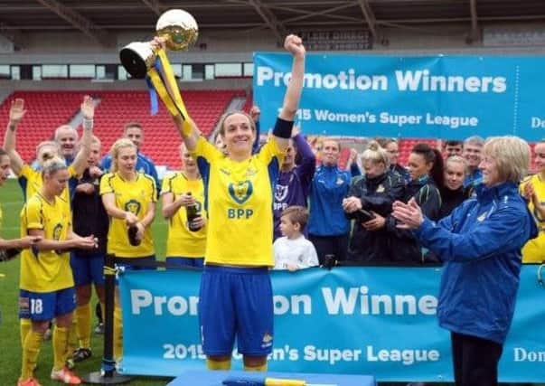 Belles skipper Leandra Little and teammates celebrate promotion back to FAWSL1.