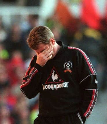 Blades boss Steve Bruce after the second Arsenal goal .