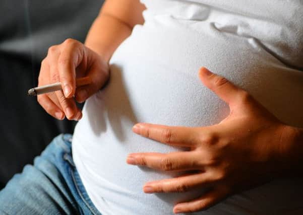 Pregnant woman smoking