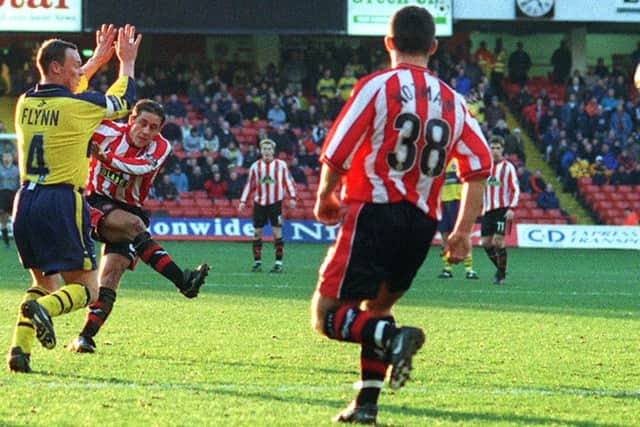 Michael Brown smashes home the last from outside the area