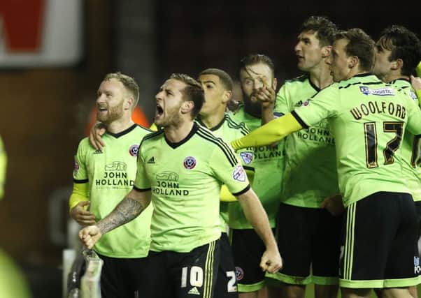 Goalscorer's Matt Done of Sheffield Utd and Billy Sharp of Sheffield Utd celebrate the equalising goal at Wigan