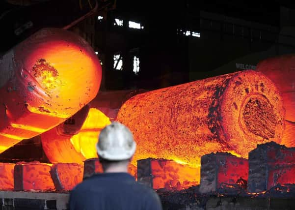 Red hot metal being moved across the heavy forge at the Forgemasters Works in Sheffield. Photo:  John Giles/PA Wire