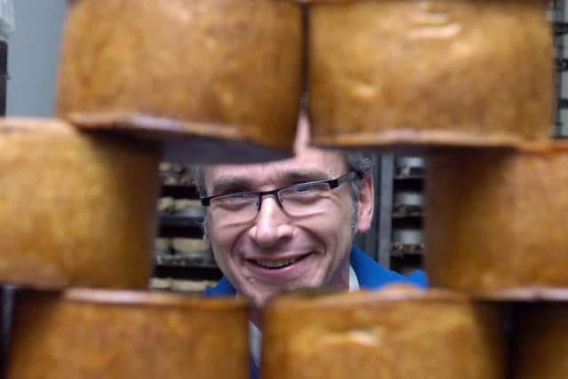 Steven Waterall of Waterall Brothers Pork Butchers looking through the pork pies