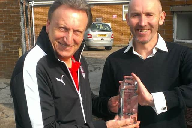 Neil Warnock and The Star's Paul Davis with the LG trophy awarded to the Millers for their Performance of the  Week at Sheffield Wednesday