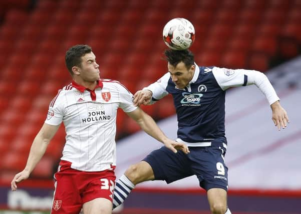 Lee Gregory tussles with Harrison McGahey at Bramall Lane earlier this season 
Â©2015 Sport Image all rights reserved