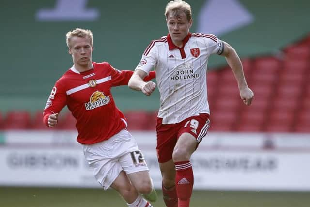 James McEveley gets in front of Lauri Dalla Valle of Crewe Alexandra during the Sky Bet League One match at Bramall Lane