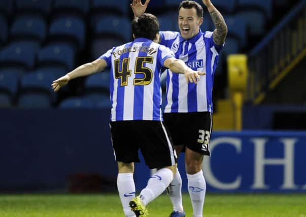 Ross Wallace celebrates the second goal with Fernando Forestieri