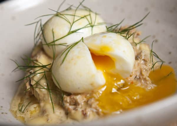 Profile writer Ellen Beardmore making Eggs Benedict at The Milestone