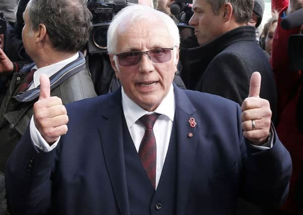 Trevor Hicks, whose daughters Sarah and Vicki died in the Hillsborough disaster, gives a thumbs up outside the Hillsborough Inquest