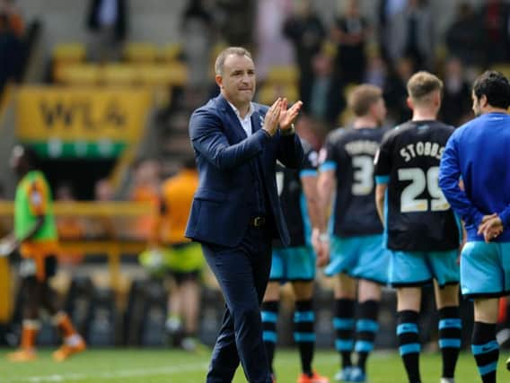 Carlos Carvalhal applauds the traveling fans at Molineux