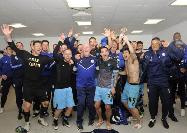 Owls celebrates in dressing room