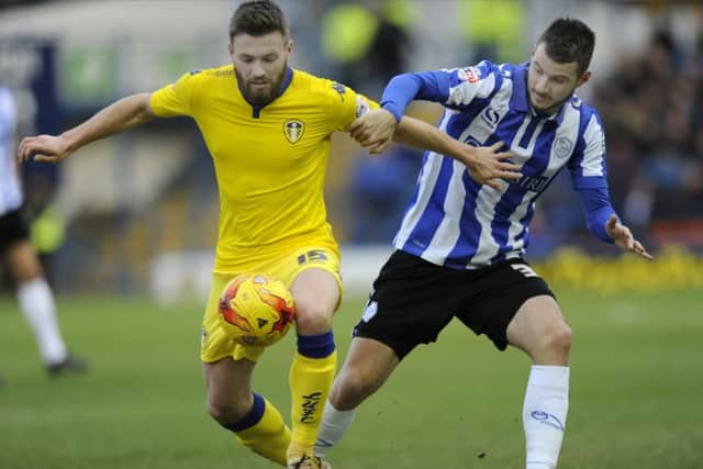 Owls Daniel pudil closes down Utds Stuart Dallas