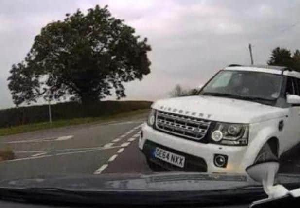 Andrew Nay's Range Rover careers into the family's car.