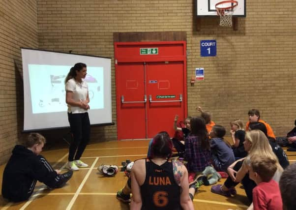 Jenna Downing speaking to young skaters in Sheffield.