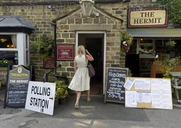 A voter enters a polling station