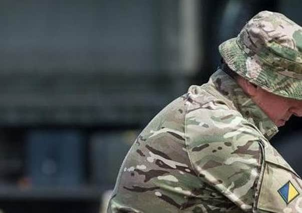 Corporal Liam Markham, left, with a colleague during the operation.