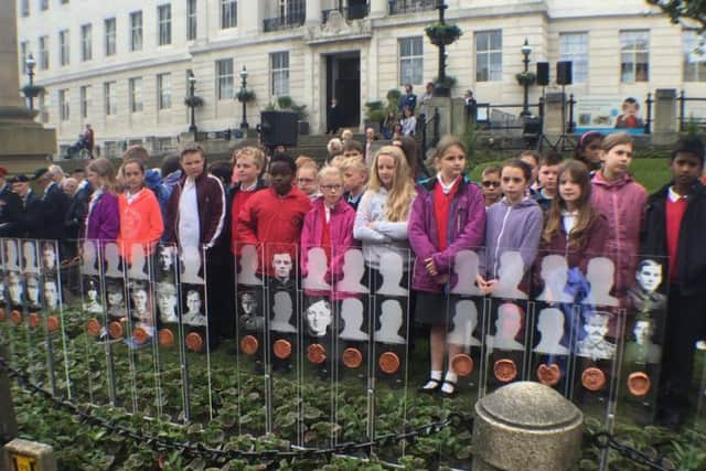 School children who made some of the medals for the Barnsley Pals art work attended the memorial service.