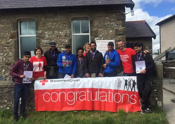 AMYA hikers present money to The Red Cross