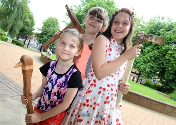 Archaeology Festival 2016 at Doncaster Museum with students from The University of Sheffield. Abbie Downs, nine, Elicia Joyes, nine, and Susanne Joyes, seven, getting hands on with some artefacts.