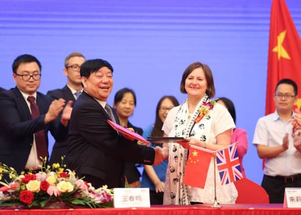 Sheffield Council leader Julie Dore signs a 60-year partnership deal with Wang Chunming, chairman and president of Chinese firm Sichuan Guodong Construction Group, in Sheffield's sister city Chengdu.