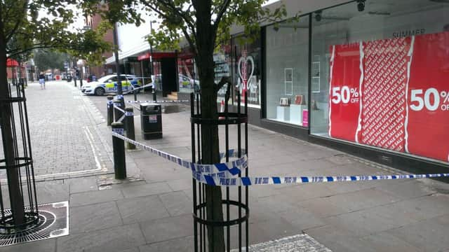 Police sealed off Printing Office Street, where there were bloodstains in a doorway