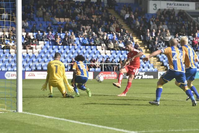 Ched Evans has his shot blocked by Shrewsbury Town goalkeeper Jayson Leutwiler