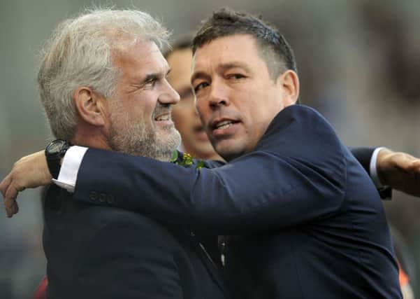 Happier says: Sheffield Eagles Chairman Ian Swire (left) and Head Coach Mark Aston embrace at a Championship Finals victory