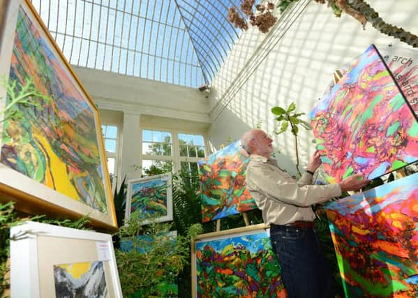 5 Sept 2105.....Artist David Brightmore with some of his paintings in one of the glasshouses in Sheffield's Botanical Gardens as part of the Art in the Gardens event. Picture Scott Merrylees SM1009/37b