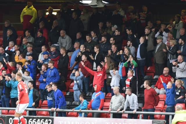 Jubiliant Rovers' fans after Tommy Rowe's goal