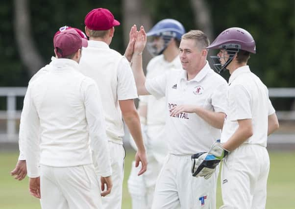 Luke Townsend (second right) took three wickets.