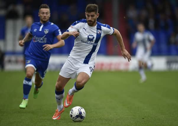 ChesterfieldÃ¢Â¬"s Ched Evans breaks away from Oldham AthleticÃ¢Â¬"s defence Picture by Steve Flynn/AHPIX.com, Football: Skybet League One  match Oldham Athletic -V- Chesterfield  at SportsDirect.com Park, Oldham, Greater Manchester, England