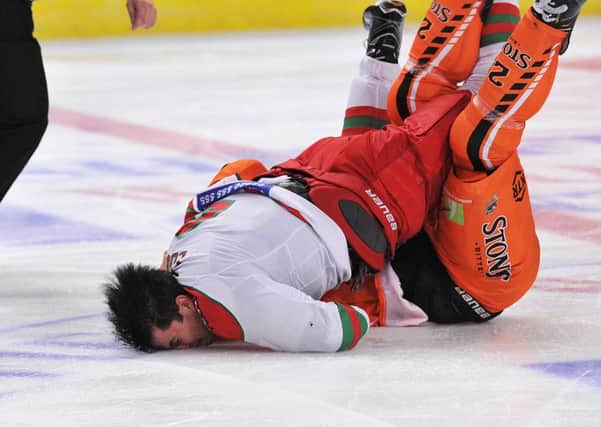 Crunch: Mark Louis hits the ice, head-first. Pic: Dean Woolley