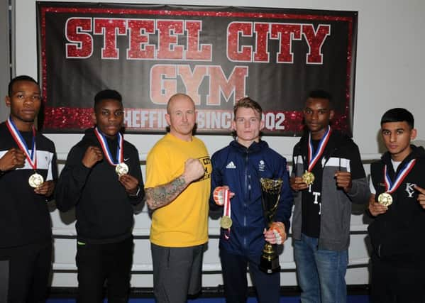 (l-r) Christopher Luteke, Dan Kinsiona, coach Grant Smith, Dalton Smith, Levi Kinsiona and Saif Yousaf, of Steel City ABC