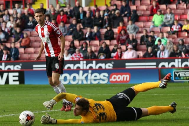 Chris Basham has a shot on goal the last time United played Orient at Bramall Lane