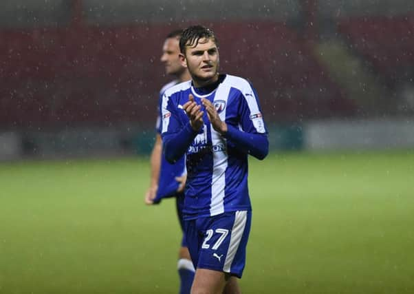 Chesterfield's  Lawrence Maguire applauds the travel fans all 74 of them (Pic: Howard Roe/ahpix.com)