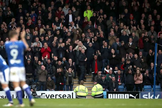 Chesterfield's Ched Evans is applauded by the fans as he is substituted