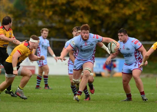 Rotherham Titans Tom MacDonald, breaks between Cornish Pirates Sam Simmonds, left, and Alex, right. Picture James Hardisty