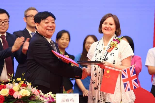 Sheffield Council leader Julie Dore signs a 60-year partnership deal with Wang Chunming, chairman and president of Chinese firm Sichuan Guodong Construction Group, in Sheffield's sister city Chengdu.