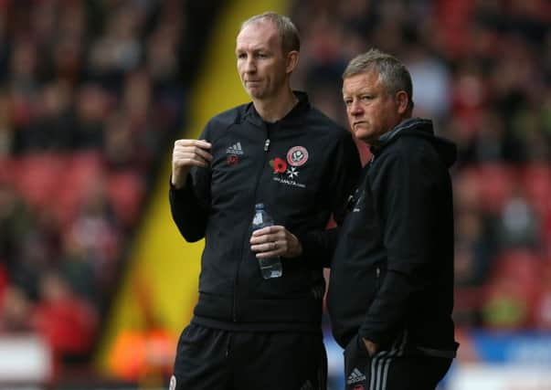 Chris Wilder (right) and his assistant Alan Knill helped Northampton Town win the League Two title last season. Pic Simon Bellis/Sportimage