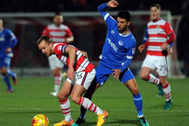 Sky Bet League Two.
Doncaster Rovers v Portsmouth.
Rovers James Coppinger under presure from Portsmouth's Danny Rose.
5th January 2017.
Picture : Jonathan Gawthorpe