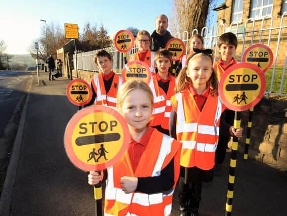 Pupils outside Loxley Primary School with headteacher James Connolly