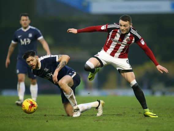 Southend's Anthony Wordsworth tussles with Sheffield United's Coalan Lavery