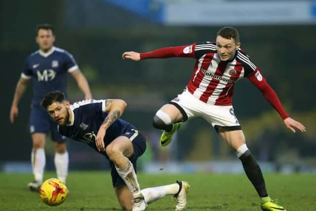 Southend's Anthony Wordsworth tussles with Sheffield United's Coalan Lavery