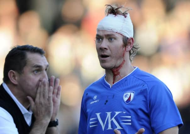 Chesterfield v Notts County....Bloody afternoon for Chesterfield defender Dean Holden as County manager Martin Allen bellows out