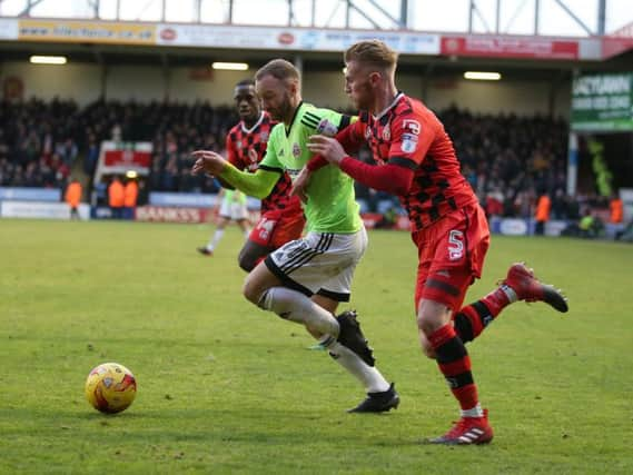 Matt Done of Sheffield Utd gets past Jason McCarthy of Walsall